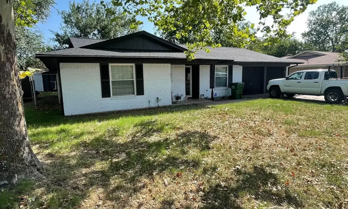 Professional roofing crew working on a residential roof in Longswamp